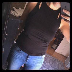 Brand new nwt sleek black tank top with cut outs!